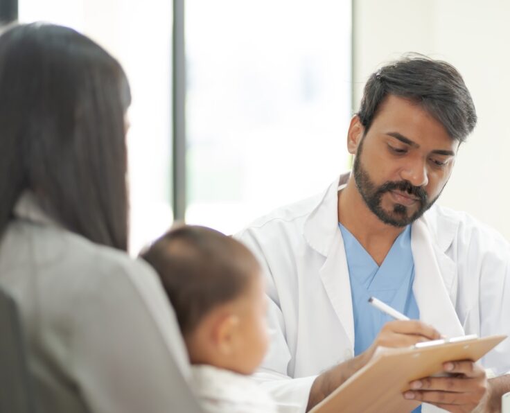 A kind doctor who treats pediatric patients. The child and his family brought him to see the doctor at the hospital because he was ill.
